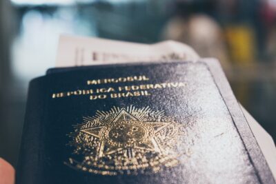 a close up of a person holding a passport